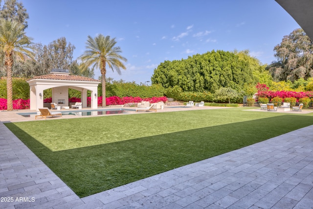 view of yard with an outdoor pool, a gazebo, and a patio