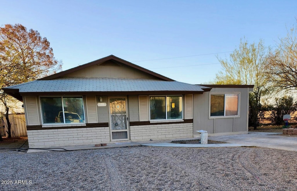 view of front of house with brick siding