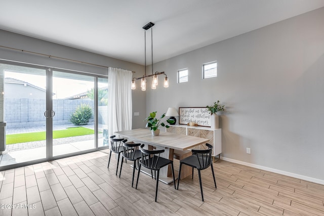 dining space featuring light wood-type flooring