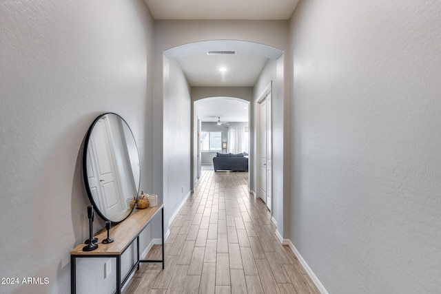 hall with light wood-type flooring