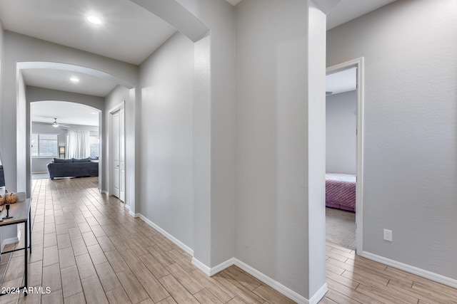 hallway with light wood-type flooring