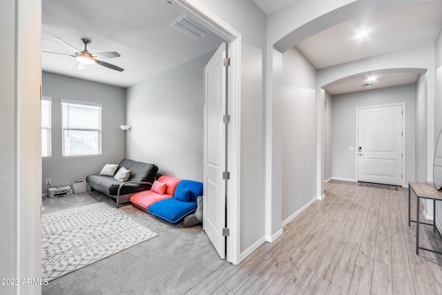 hallway with light hardwood / wood-style flooring