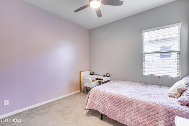 bedroom with light carpet and ceiling fan