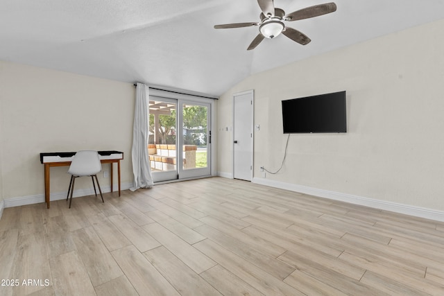 living area with a ceiling fan, light wood-type flooring, lofted ceiling, and baseboards