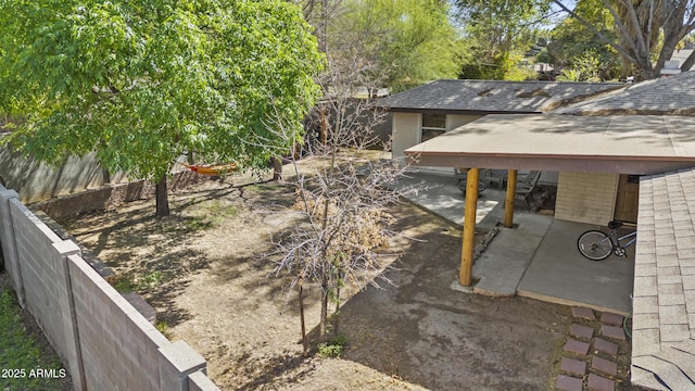 view of yard featuring a patio and fence