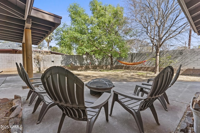 view of patio / terrace with an outdoor fire pit and a fenced backyard