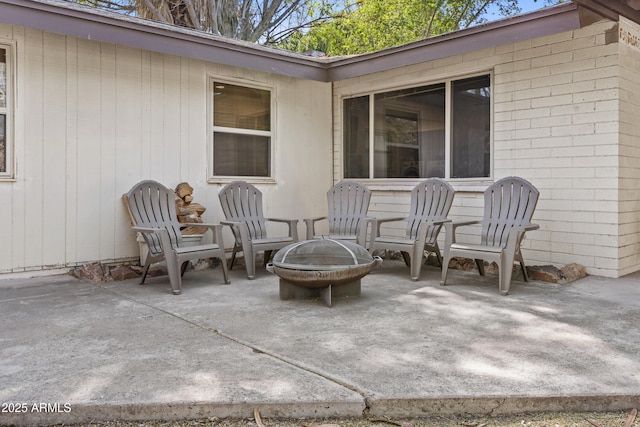 view of patio with an outdoor fire pit