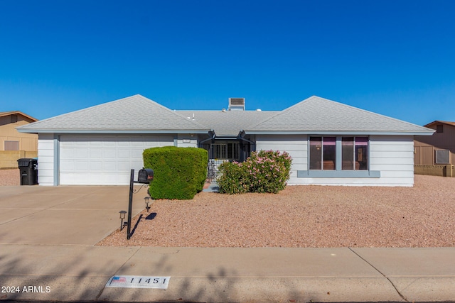 ranch-style house featuring a garage