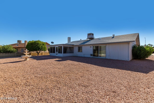 rear view of property featuring a patio and cooling unit