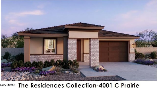 prairie-style home with brick siding, fence, stucco siding, a garage, and driveway