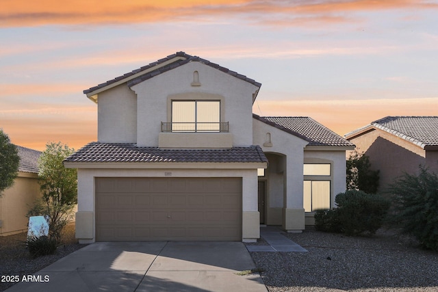 mediterranean / spanish-style home featuring a garage