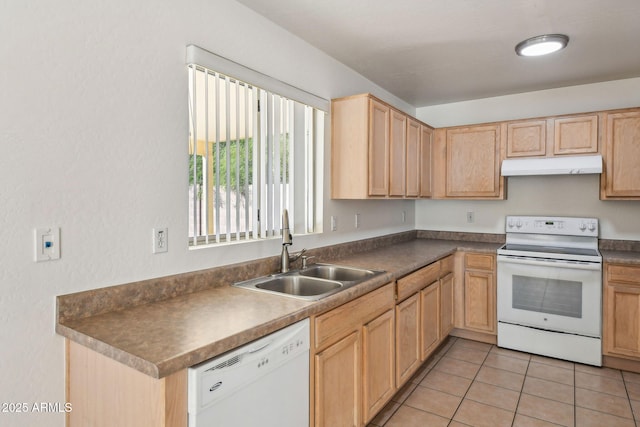 kitchen with sink, white appliances, and light tile patterned floors