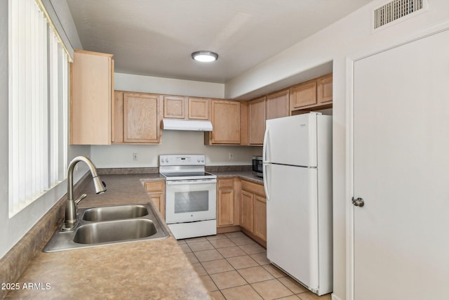 kitchen with light brown cabinetry, sink, white appliances, and light tile patterned floors