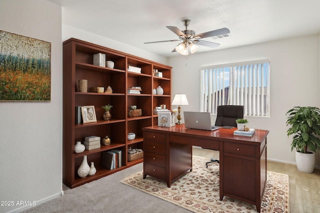 home office featuring ceiling fan and light colored carpet