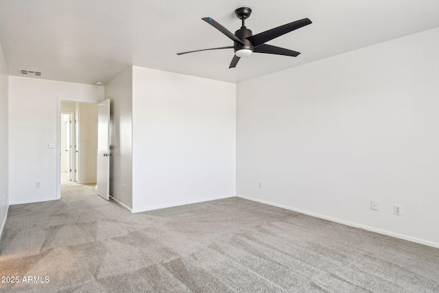 carpeted empty room with ceiling fan