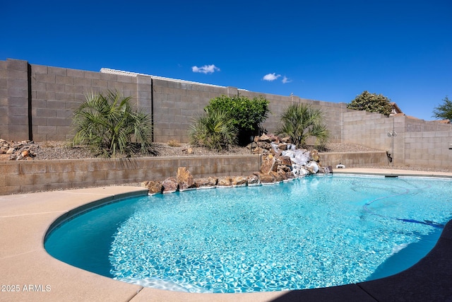view of pool featuring a fenced in pool and a fenced backyard