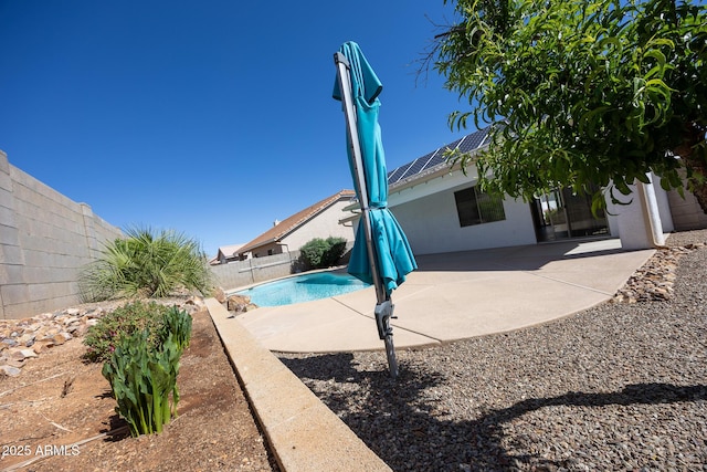 view of pool with a fenced in pool, a fenced backyard, and a patio area