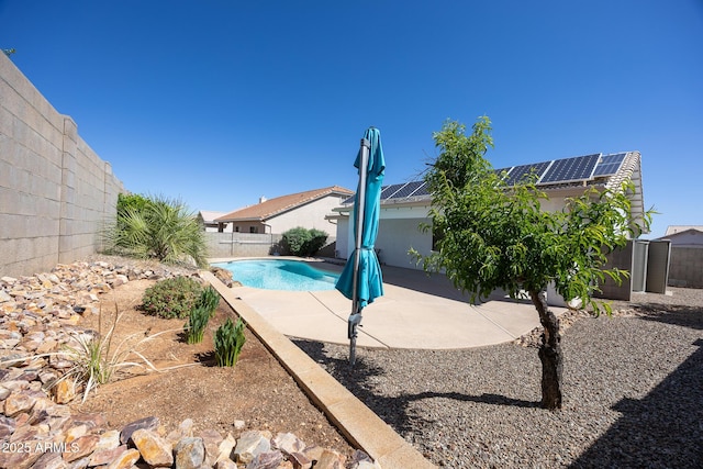 view of swimming pool with a fenced in pool, a fenced backyard, and a patio area