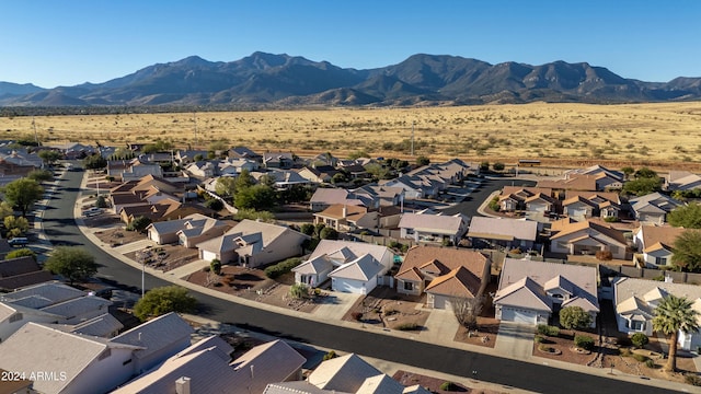 birds eye view of property with a mountain view and a residential view