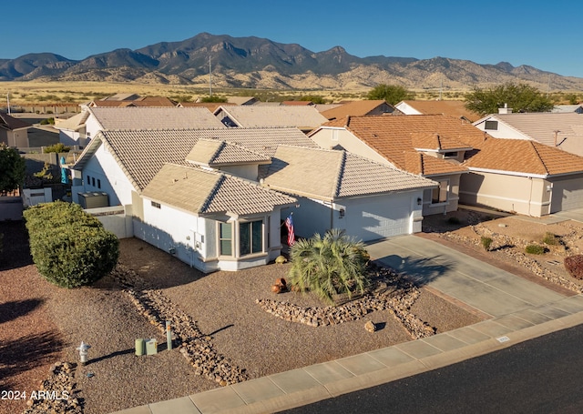 birds eye view of property featuring a mountain view and a residential view