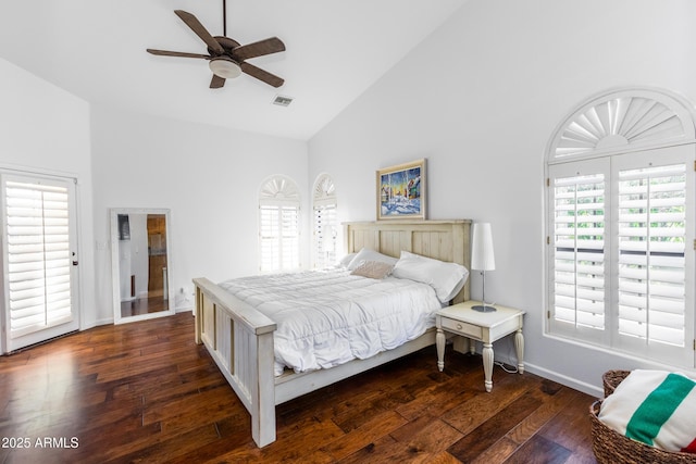 bedroom with dark wood-type flooring, high vaulted ceiling, and ceiling fan