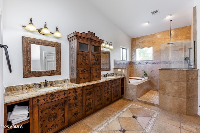 bathroom featuring vaulted ceiling, plus walk in shower, and vanity