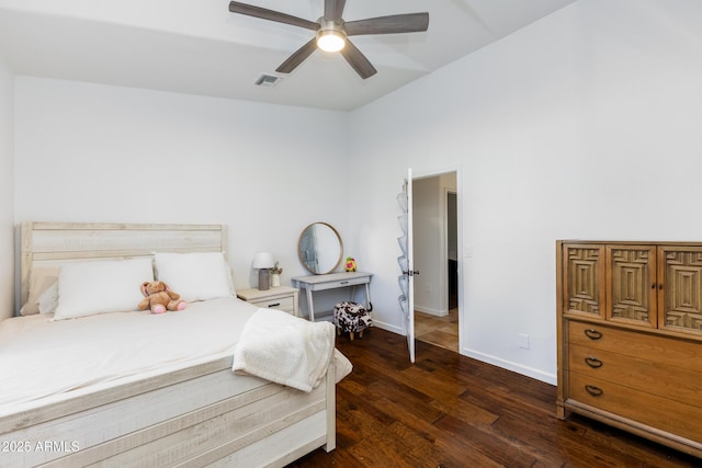 bedroom with ceiling fan and dark hardwood / wood-style floors