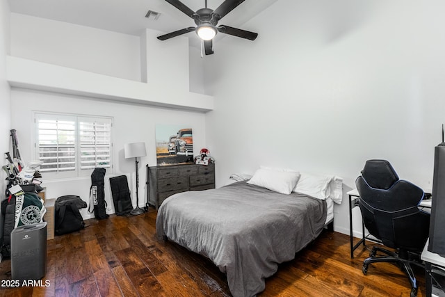 bedroom featuring ceiling fan and dark wood-type flooring