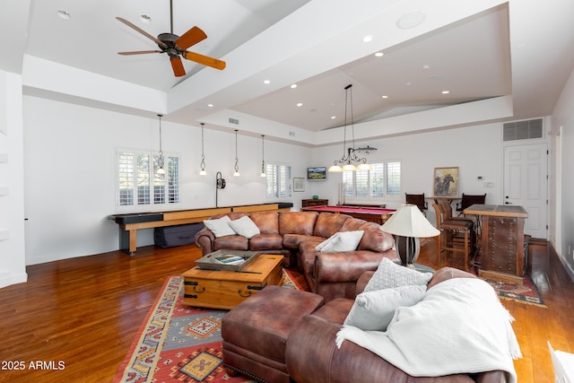 living room featuring billiards, dark hardwood / wood-style floors, lofted ceiling, a tray ceiling, and ceiling fan