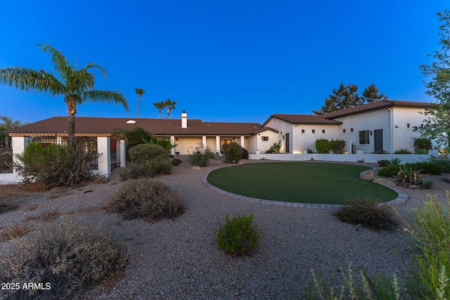 view of front of home with a front lawn