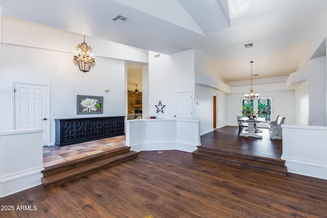 interior space with lofted ceiling and wood-type flooring