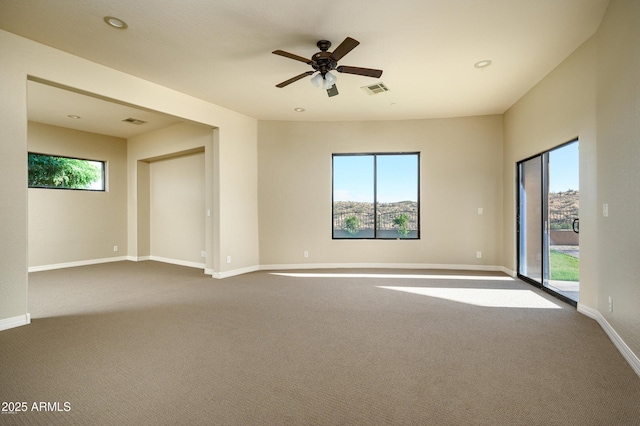 16569 E Trevino Dr, Fountain Hills, AZ 85268 - spare room featuring dark carpet, healthy amount of natural light, a ceiling fan, and recessed lighting