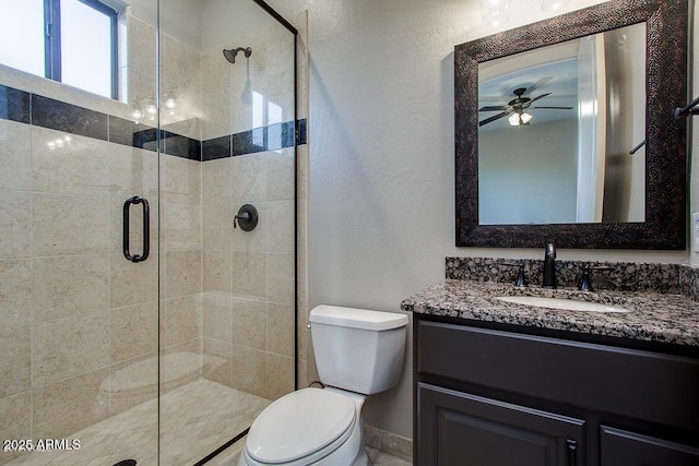 16569 E Trevino Dr, Fountain Hills, AZ 85268 - bathroom with vanity, a stall shower, a ceiling fan, and a textured wall