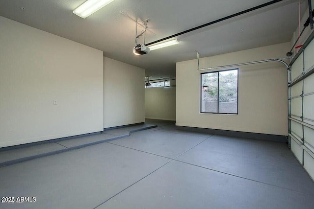 16569 E Trevino Dr, Fountain Hills, AZ 85268 - garage with baseboards and a garage door opener