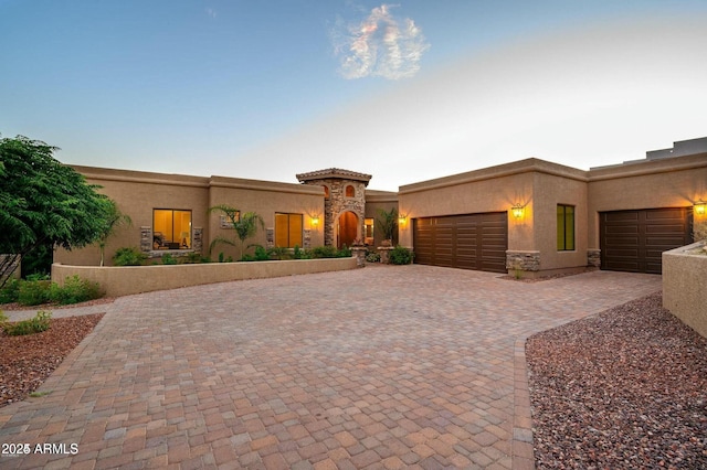 16569 E Trevino Dr, Fountain Hills, AZ 85268 - view of front facade with stucco siding, a garage, and driveway