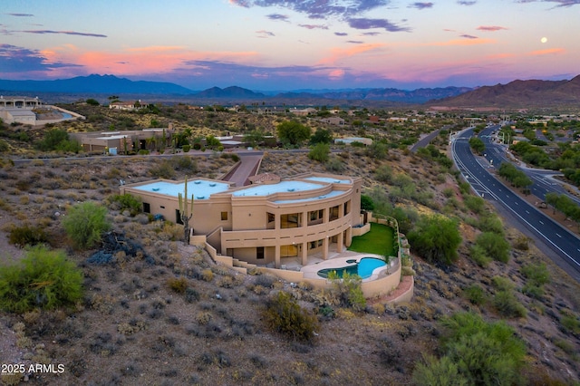 16569 E Trevino Dr, Fountain Hills, AZ 85268 - aerial view at dusk of a mountain view and view of pool area