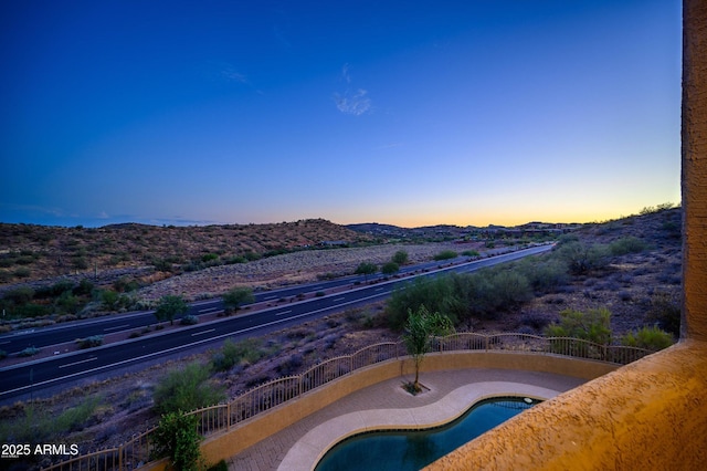 16569 E Trevino Dr, Fountain Hills, AZ 85268 - pool at dusk featuring a mountain view
