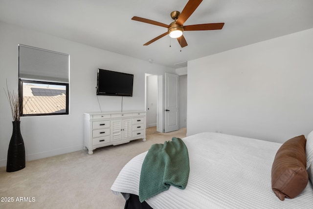 bedroom featuring ceiling fan and light carpet