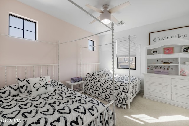 bedroom featuring ceiling fan and light carpet