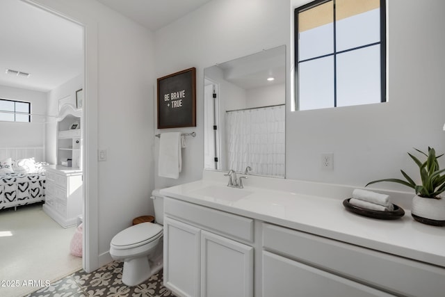 bathroom featuring vanity and toilet