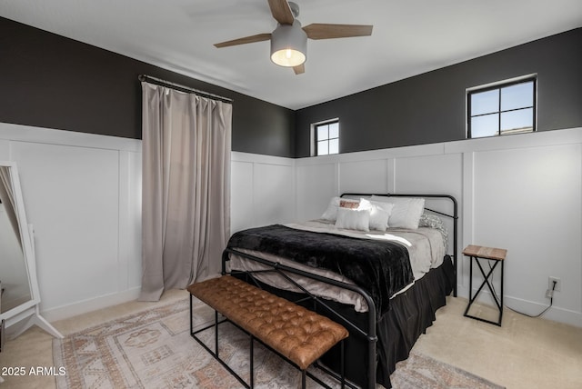 bedroom with light carpet and ceiling fan