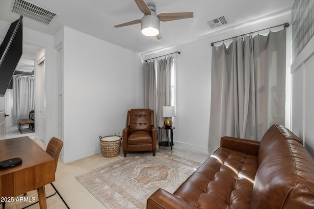 living area with ceiling fan