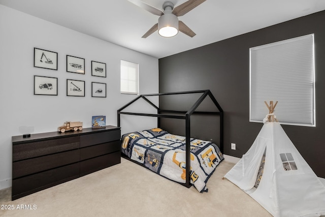 carpeted bedroom with ceiling fan