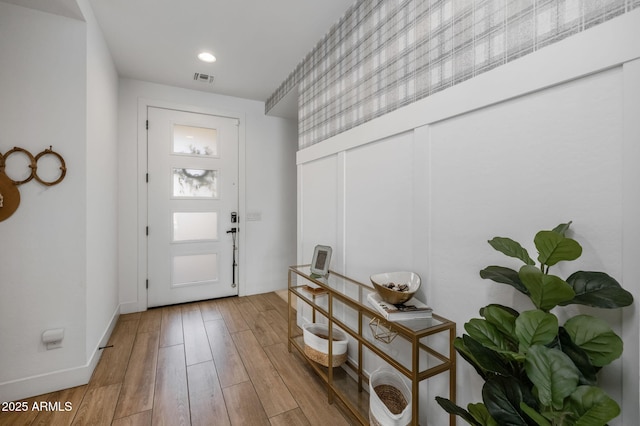 entryway with wood-type flooring