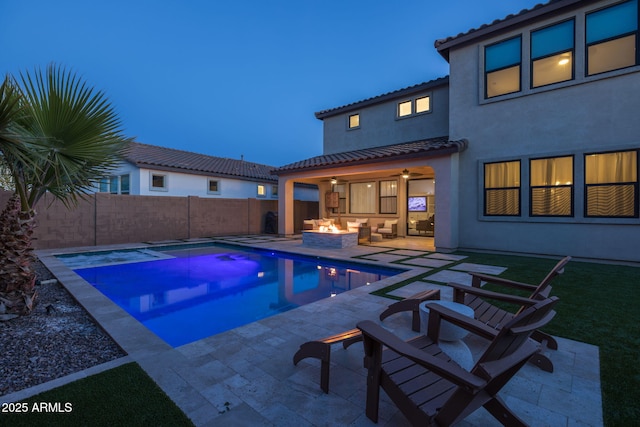 view of swimming pool with an outdoor fire pit and a patio