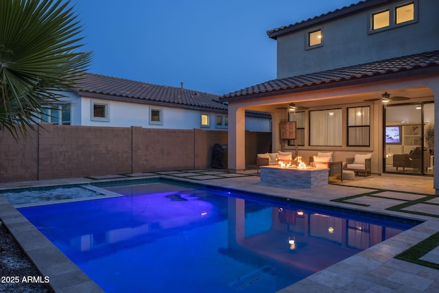 view of pool featuring ceiling fan, a fire pit, and a patio