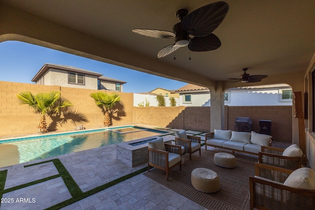 view of patio featuring an outdoor hangout area, a swimming pool with hot tub, and ceiling fan