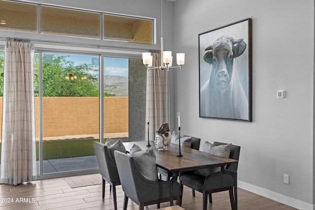 dining area featuring a chandelier and hardwood / wood-style flooring