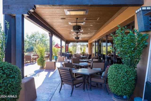 view of patio featuring ceiling fan