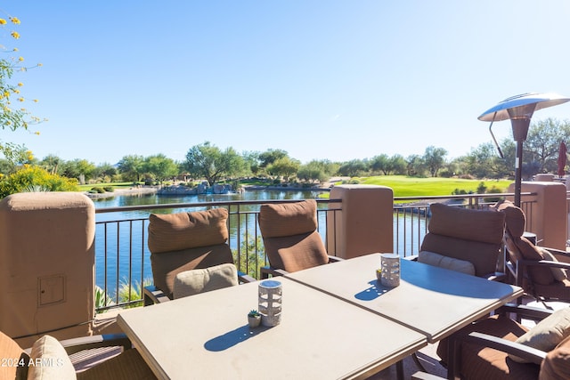 wooden deck featuring a water view